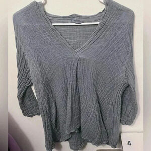 Woman’s light blue / cardigan top / sweater